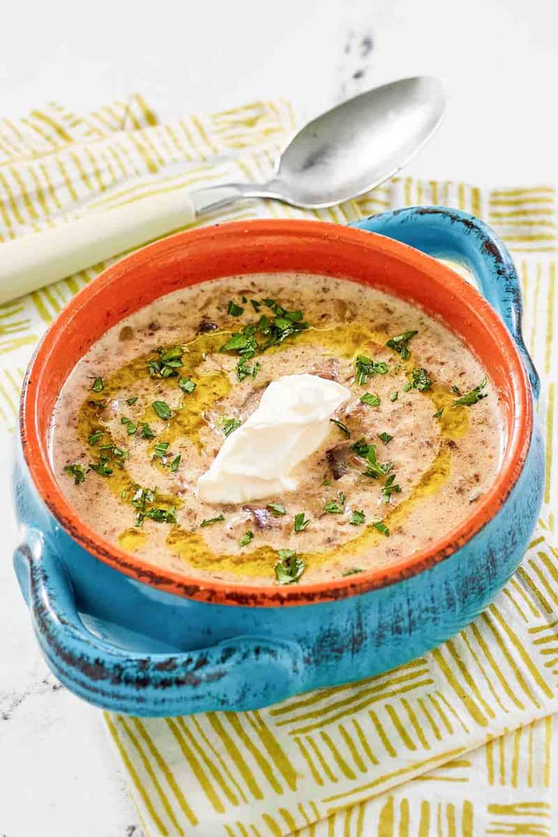 Copycat Longhorn Steakhouse mushroom bisque topped with a dollop of sour cream.