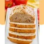 A loaf of apple bread on a rectangular platter.