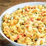 Homemade boston market squash casserole in a serving bowl on a table.