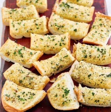 Copycat Brennan's garlic bread on a wood cutting board.