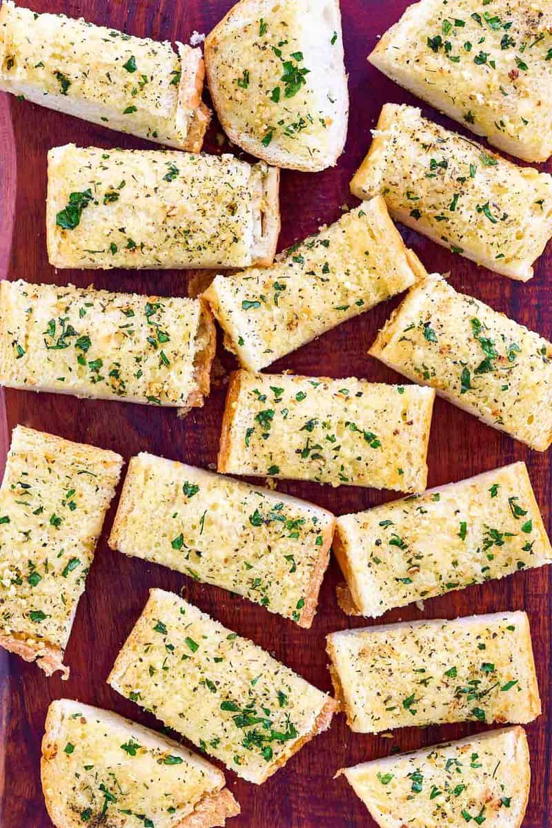 Copycat Brennan's garlic bread slices on a wood board.