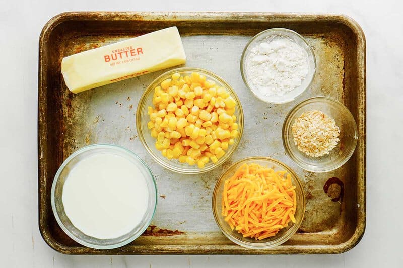 Cheesy creamed corn ingredients on a tray,