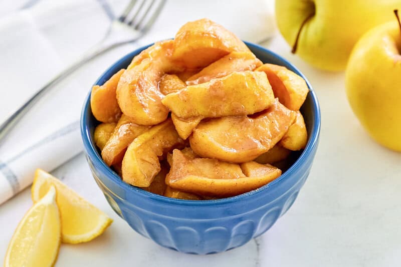 Copycat cracker barrel fried apples, apples, and lemon wedges.