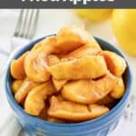 Homemade cracker barrel fried apples in a bowl and a fork next to it.