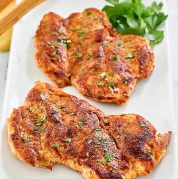 Copycat cracker barrel smoky southern chicken breasts on a platter.