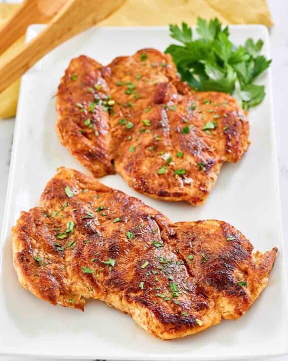 Copycat cracker barrel smoky southern chicken breasts on a platter.