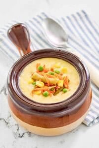 Copycat Dolly Parton Dixie Stampede creamy vegetable soup in a soup crock.