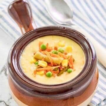 Copycat Dolly Parton Dixie Stampede creamy vegetable soup in a soup crock.