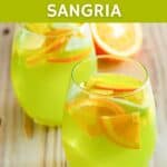 Copycat Olive Garden green apple sangria in two stemless wine glasses.