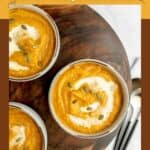 Three bowls of copycat Panera autumn squash soup on a table.