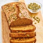 Copycat starbucks pumpkin breadstuff  and a tiny  vessel  of pumpkin seeds.