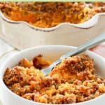 A bowl of sweet potato casserole with pecan topping.