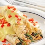 Copycat ihop chicken florentine crepes on a plate.