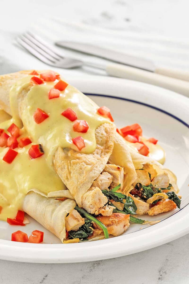 Copycat ihop chicken florentine crepes on a plate.