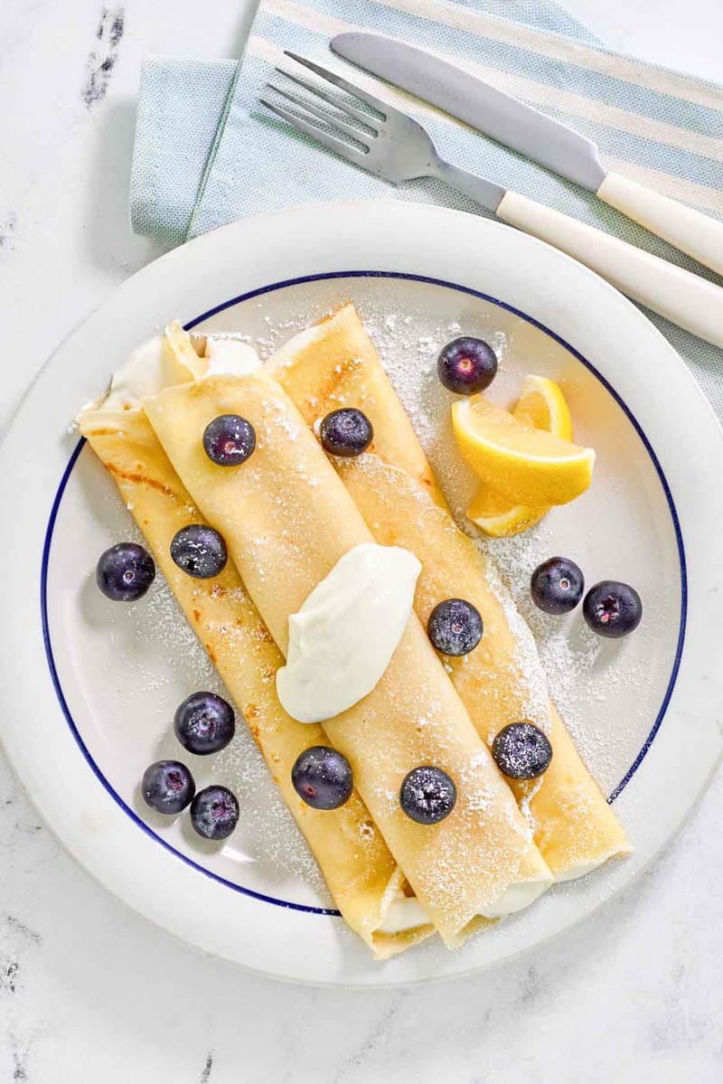 Copycat ihop lemon ricotta crepes with fresh blueberries on top.