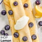 Homemade ihop lemon ricotta crepes with fresh blueberries on top.