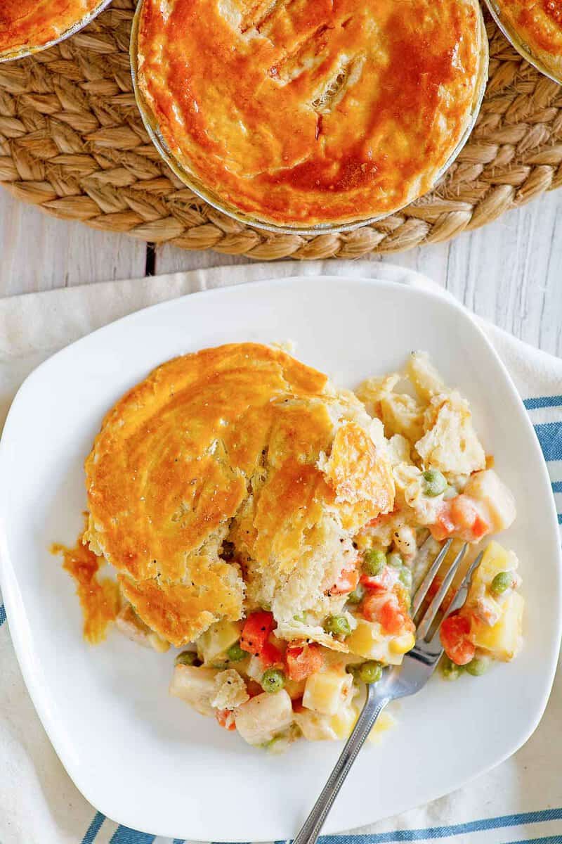 Copycat KFC chicken pot pie on a plate and a braided mat.