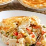 Homemade KFC chicken pot pie that has been broken open by a fork.