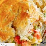 Homemade KFC chicken pot pie and a fork on a plate.