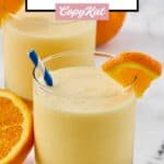 Homemade orange julius garnished with an orange slice.