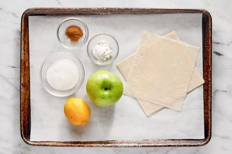 Copycat panda express apple pie egg rolls ingredients on a tray.