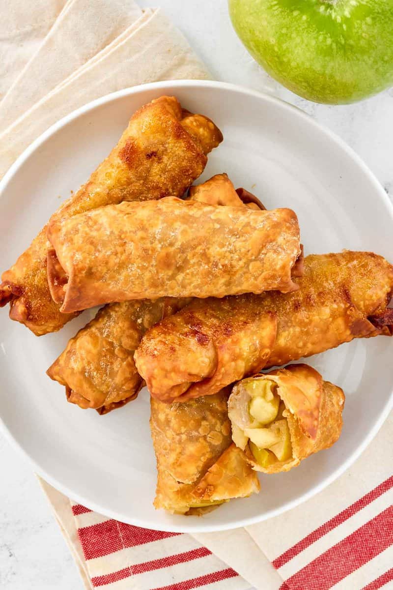 Copycat panda express apple pie egg rolls and a green apple.