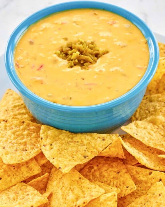 Copycat Pappasito's queso dip and tortilla chips next to it.