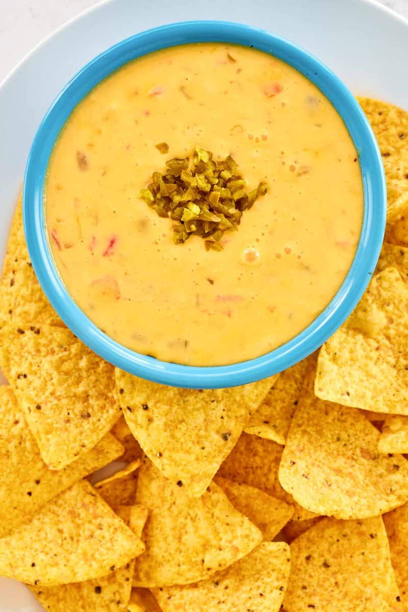 Copycat Pappasito's queso dip and tortilla chips on a platter.