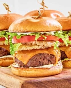 Copycat red robin banzai burger on a wood cutting board.