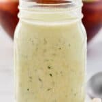 Homemade buttermilk ranch dressing in a glass mason jar.