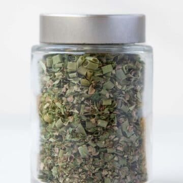 Homemade fines herbes in a spice jar.