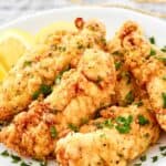 Homemade Piada fried chicken tenders on a plate.