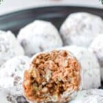 Homemade rum balls coated with powdered sugar.