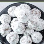 Homemade rum balls piled on a platter.