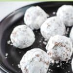 Several homemade rum balls on a plate.