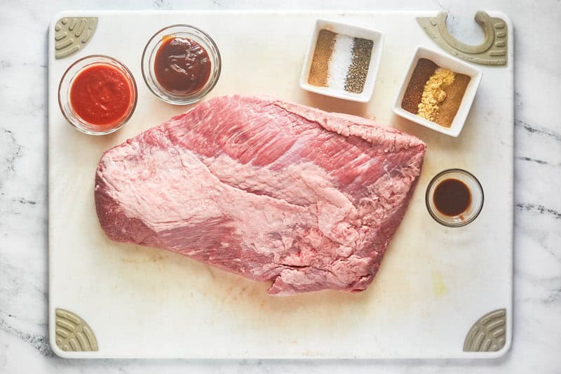 Copycat Chipotle smoked brisket ingredients on a cutting board.