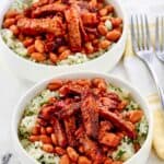 Copycat Chipotle smoked brisket over rice in two bowl.