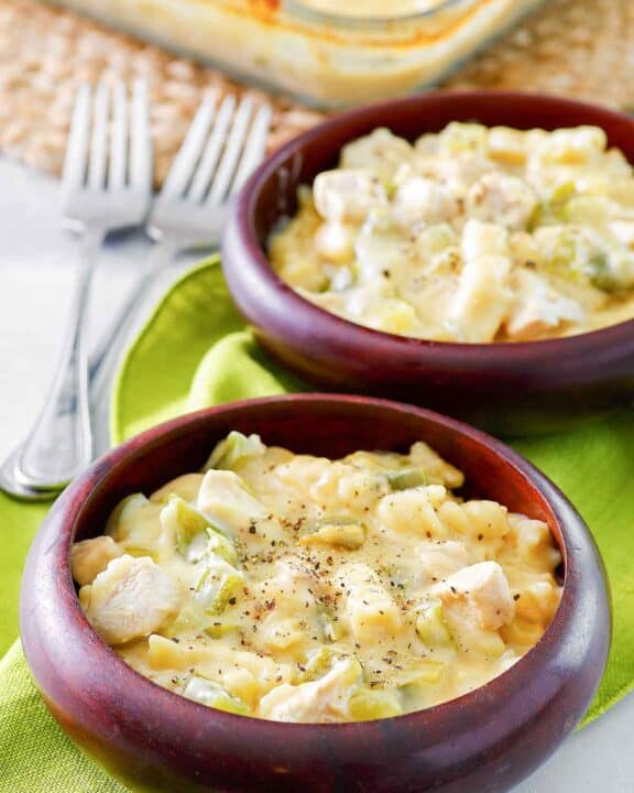 Everyday chicken casserole in a baking dish and two bowls.