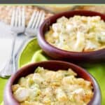 Everyday chicken casserole with cheese and noodles in two bowls.