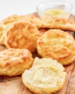 Copycat Popeyes biscuits on a wood board.