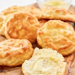 Copycat Popeyes biscuits on a wood board.