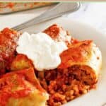 A serving of stuffed cabbage rolls on a plate.