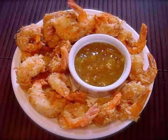 Copycat Joe's Crab Shack dipping sauce and fried shrimp around it.