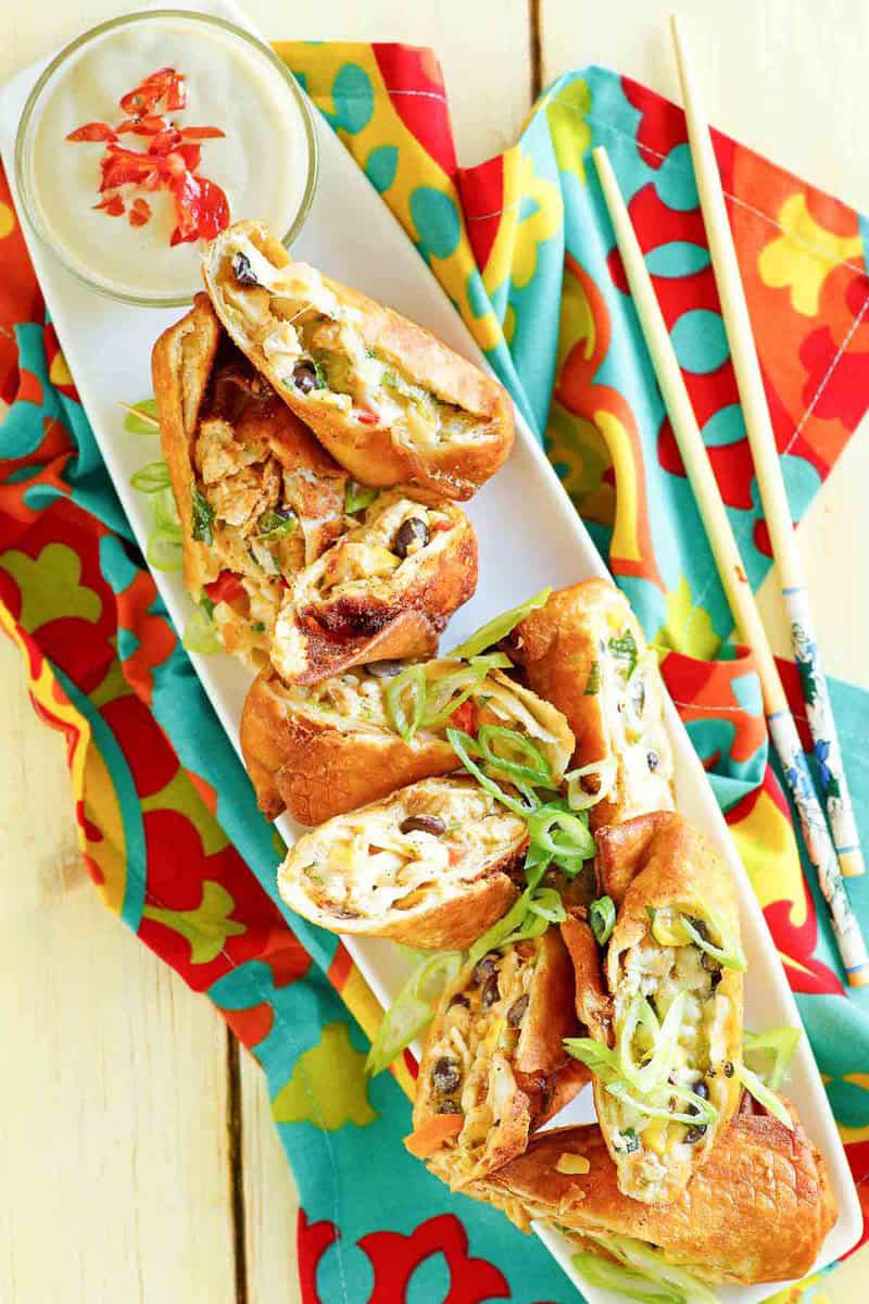 Copycat Chili's southwest egg rolls and avocado ranch dipping sauce.