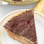 Chocolate peanut butter pie with graham cracker crust on a plate.