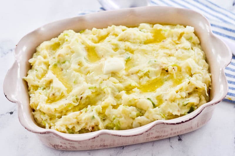 Traditional Irish colcannon potatoes with melted butter on top.