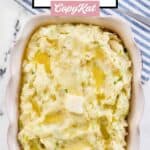 Irish colcannon potatoes in a dish and a serving spoon on a cloth napkin.