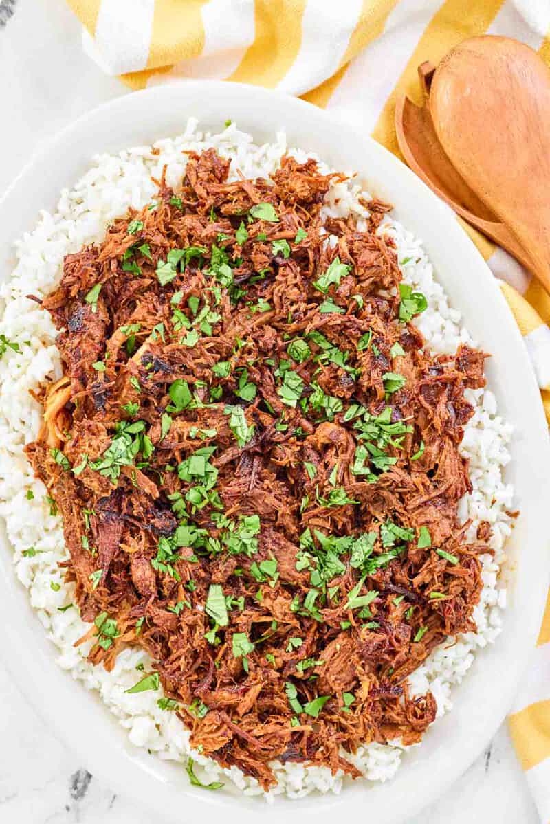 Instant pot pulled pork on an oval platter.