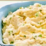 Irish champ mashed potatoes in a ceramic serving dish.