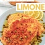 Homemade Buca de Beppo chicken limone and lemon slices on a plate.